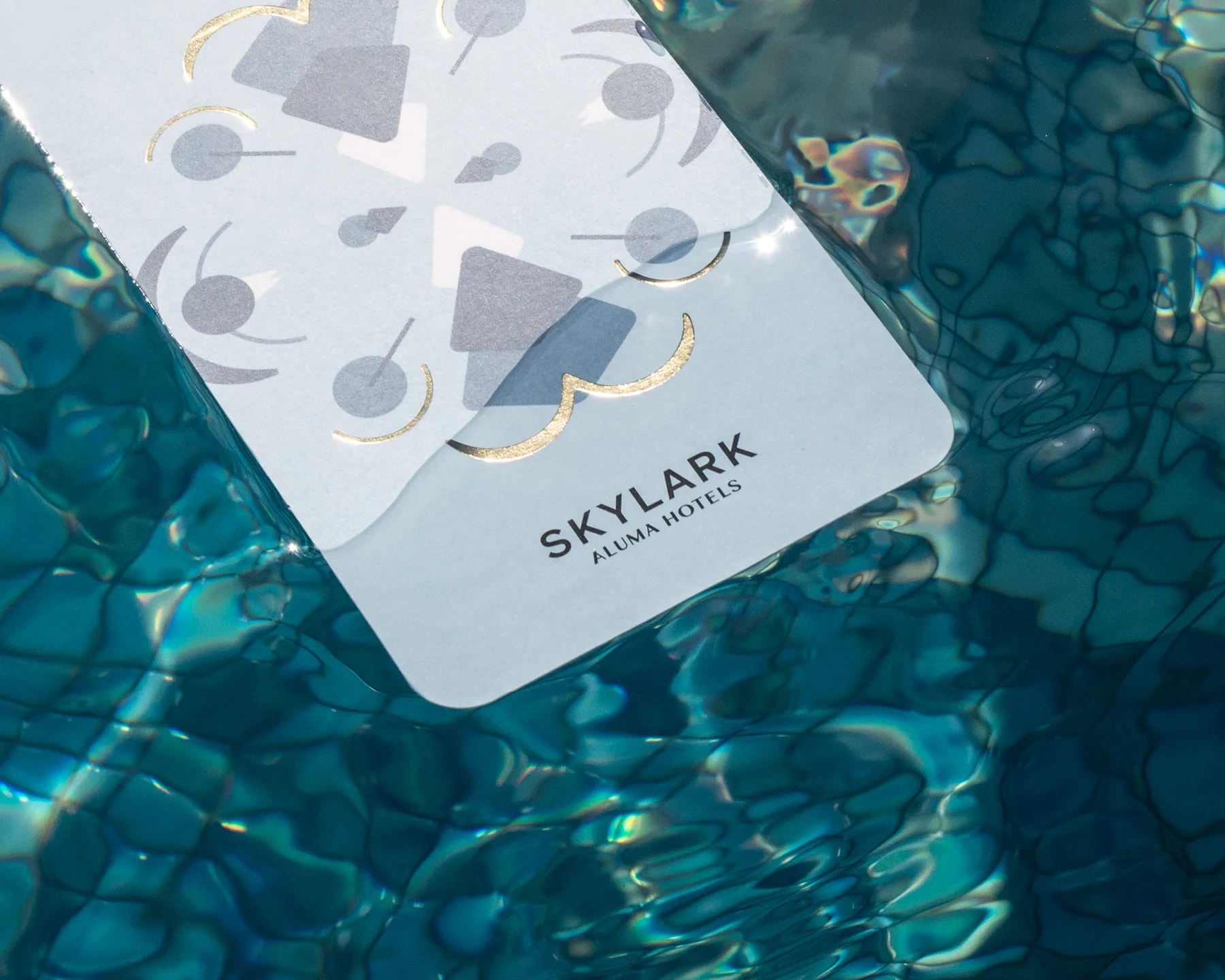 Aluma Hotels & Resorts – brand identity and signage design by Basman/Tenenbaum