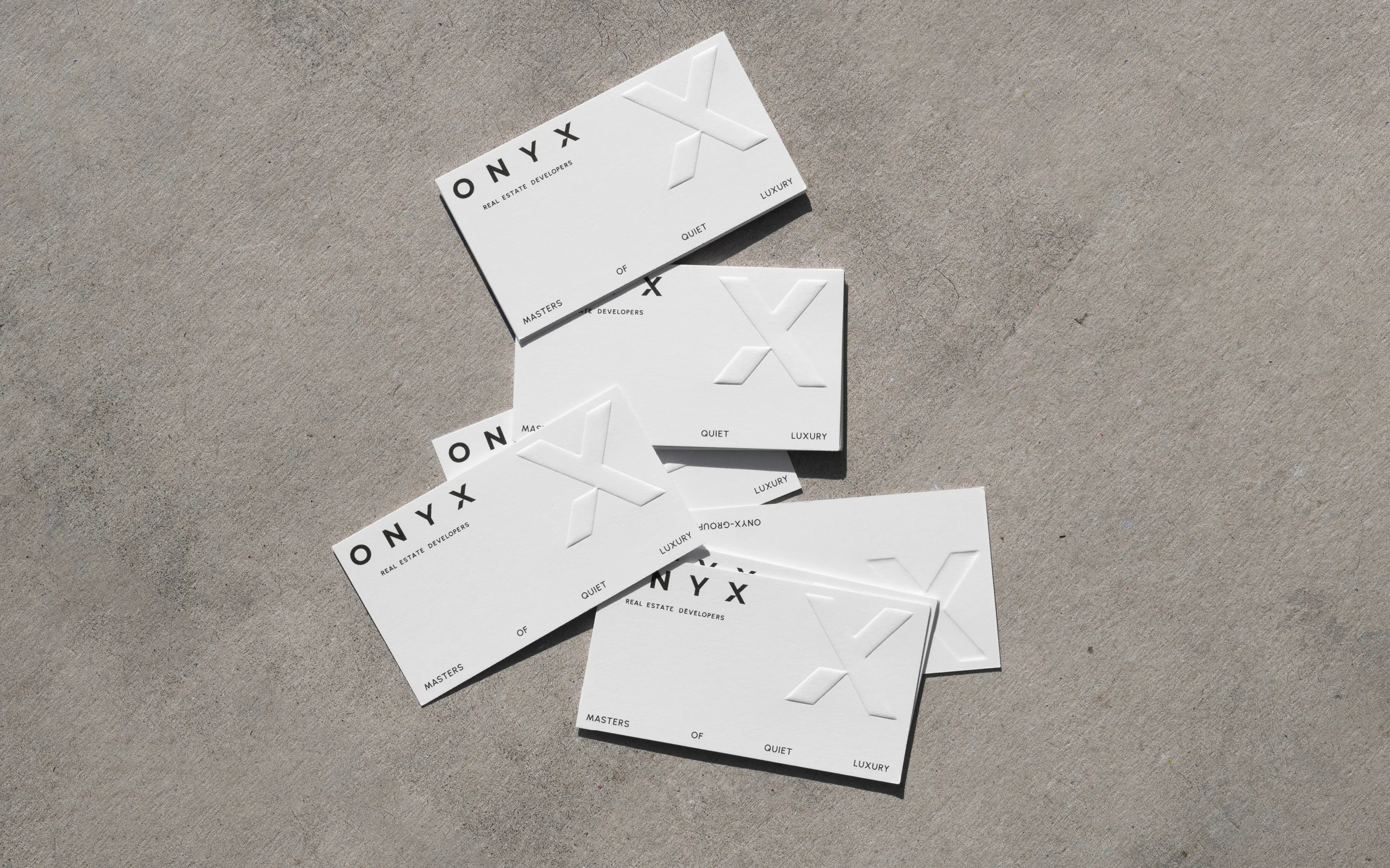 ONYX Real Estate Developers – brand identity and web design by Basman/Tenenbaum