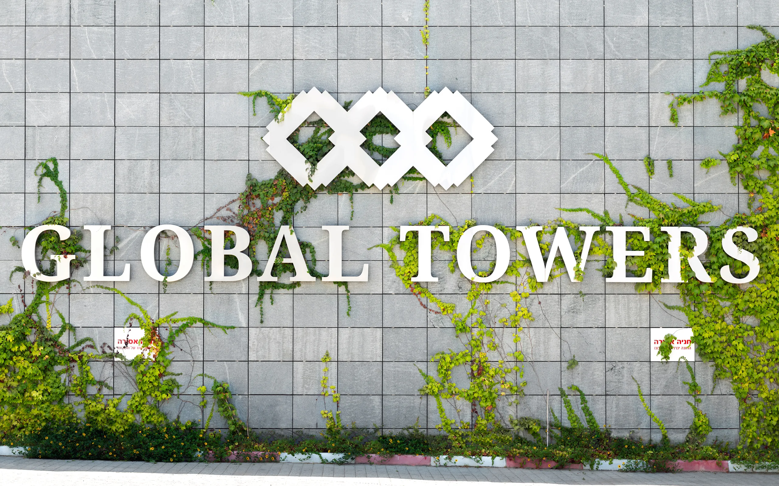 Global Towers – signage design by Basman/Tenenbaum